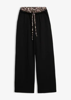 bonprix bonprix Pantalón de chándal ancho con cintura en contraste estampado leo negro Hot