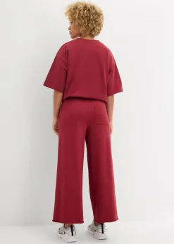 bonprix bonprix Pantalón de chándal de algodón orgánico con largo capri Ciruela Outlet
